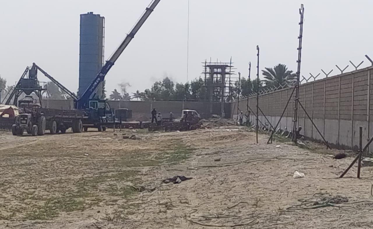 Boundary wall and watchtower construction with crane support
