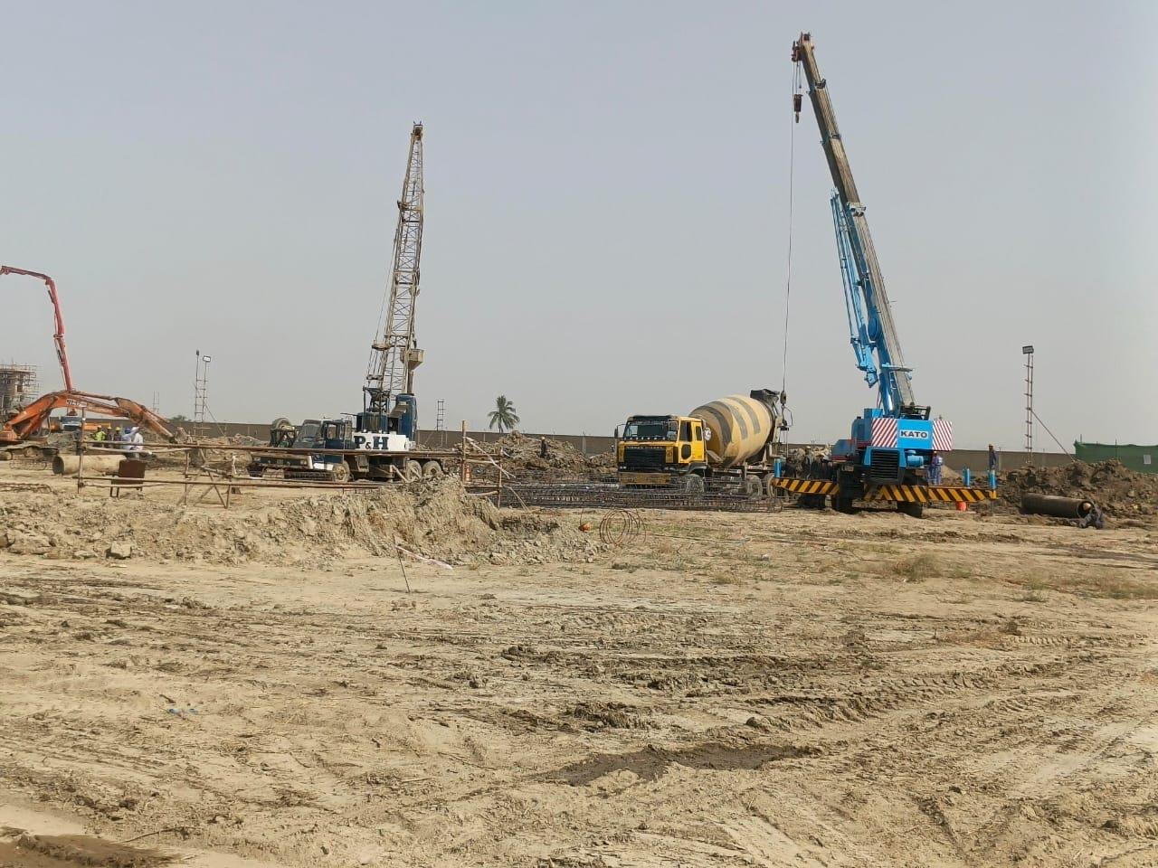 Cranes and concrete mixer truck on a Marvel Engineering civil construction site