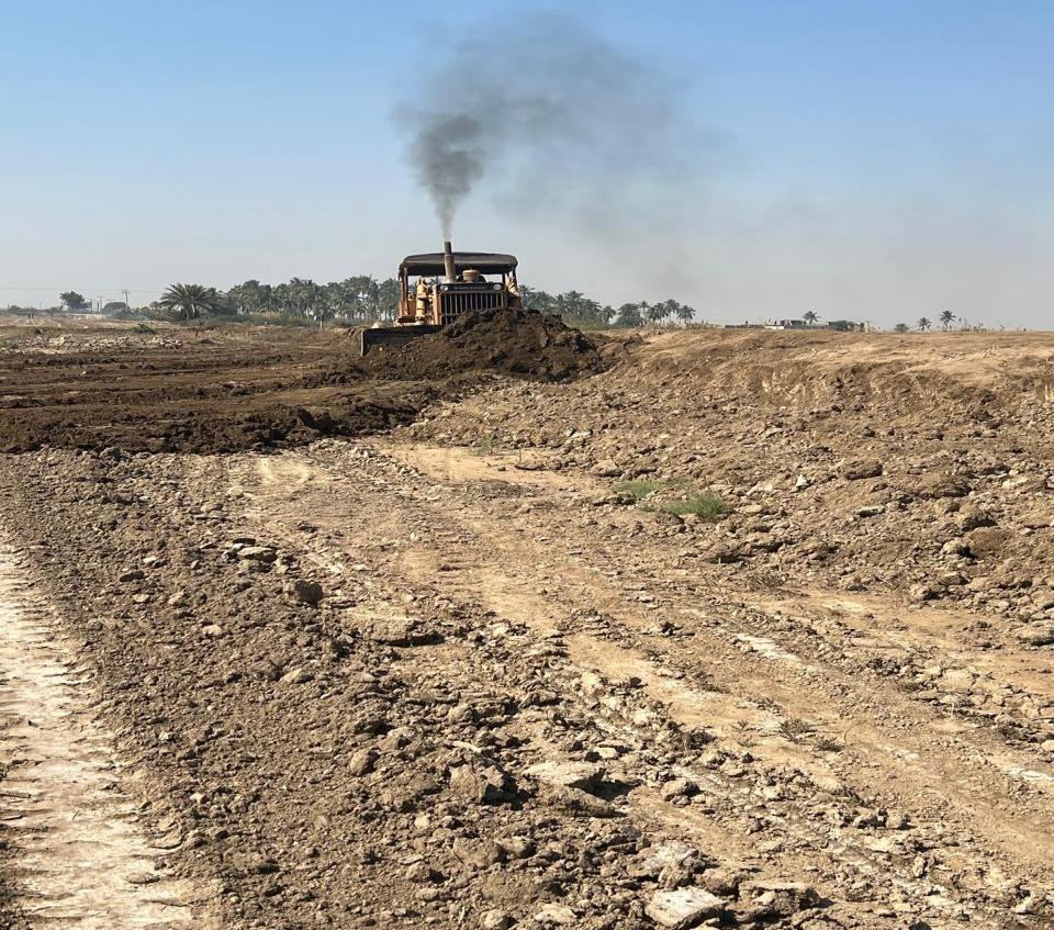 Bulldozer performing earthworks and site grading